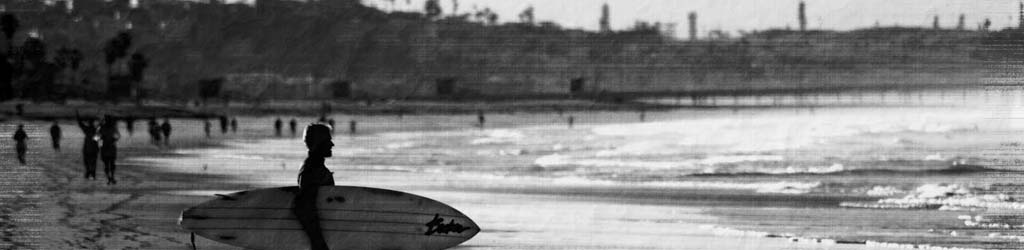 Surfer on the beach at dawn, Santa Monica